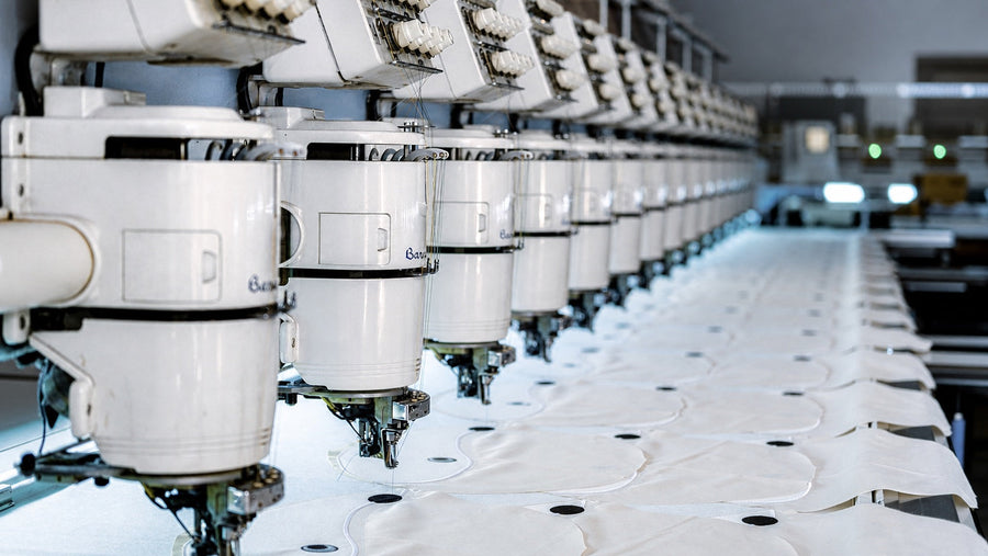 Automated embroidery equipment used in modern apparel manufacturing